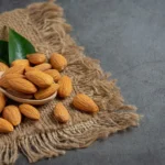 Almonds bowl dark background