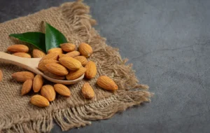 Almonds bowl dark background